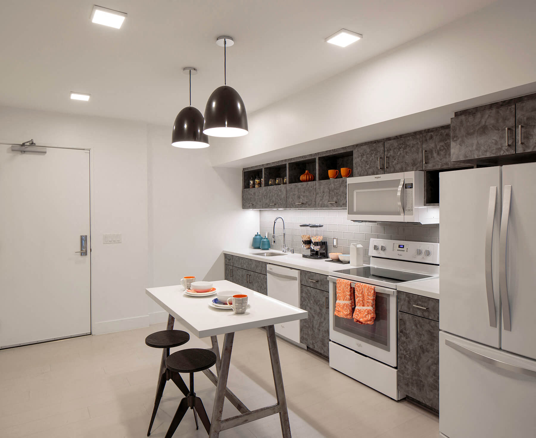 A sleek, modern kitchen at the Idea1 Apartments in San Diego, California.